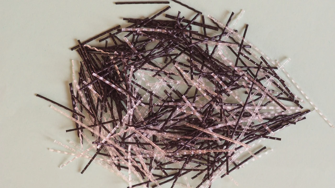 Concrete reinforcing fiber for strength and durability