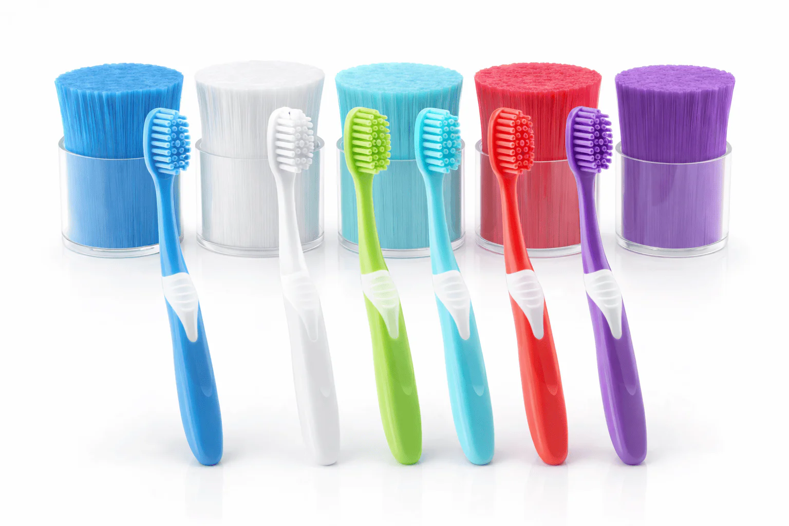 Colorful toothbrushes with monofilament bristles for effective oral hygiene.